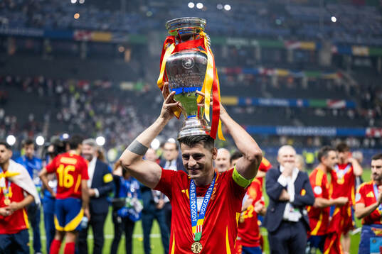 Alvaro Morata of Spain celebrates with the trophy