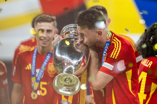 Joselu of Spain celebrates with the trophy