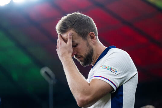 Harry Kane of England looks dejected