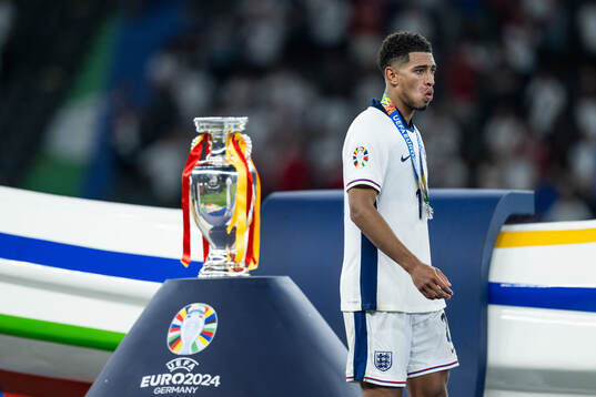 Jude Bellingham of England looks dejected as he walks past