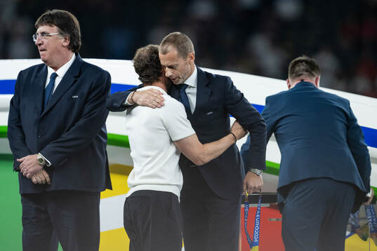 Head coach Gareth Southgate of England hugs Aleksander