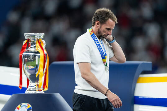 Head coach Gareth Southgate of England looks dejected as he