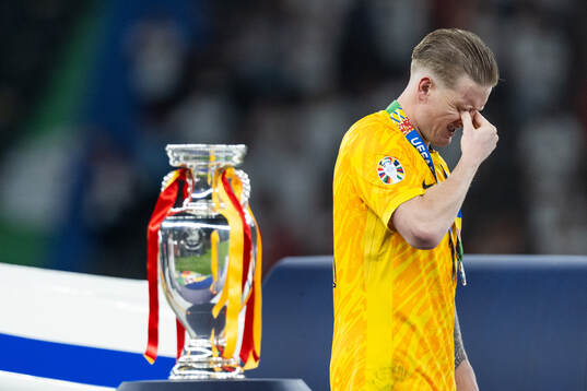 Goalkeeper Jordan Pickford of England looks dejected as he