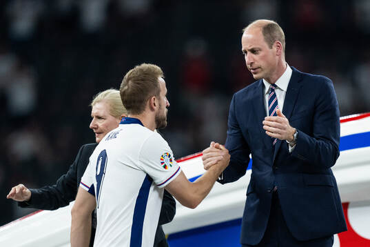 Prince William of Great Britain greets Harry Kane of England