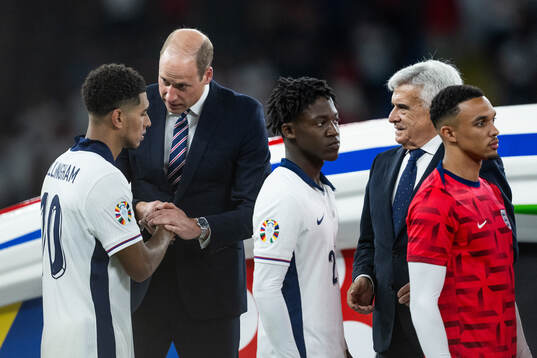 Prince William of Great Britain greets Jude Bellingham of