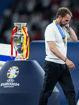 Head coach Gareth Southgate of England looks dejected as he