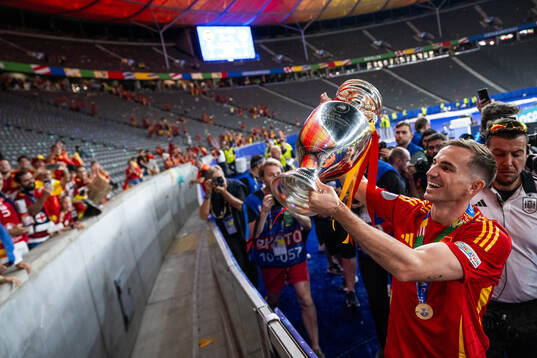 Fabian Ruiz Pena of Spain celebrates with the trophy