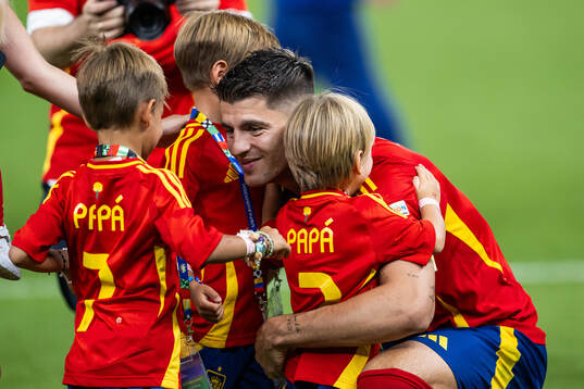 Alvaro Morata of Spain celebrates with his children