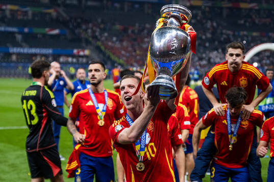 Daniel Olmo of Spain celebrates with the trophy