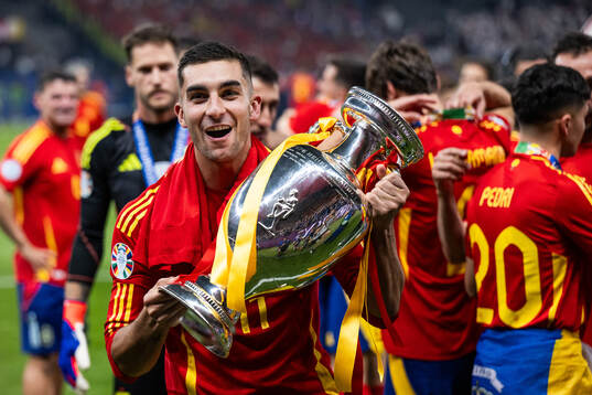 Ferran Torres of Spain celebrates with the trophy
