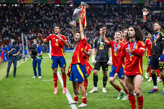 Jesus Navas of Spain celebrates with the trophy