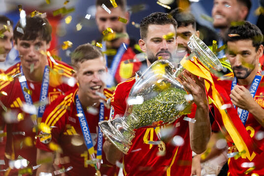 Nacho of Spain celebrates with the trophy