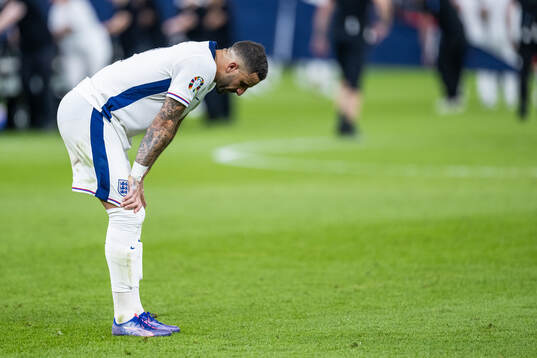 Kyle Walker of England looks dejected