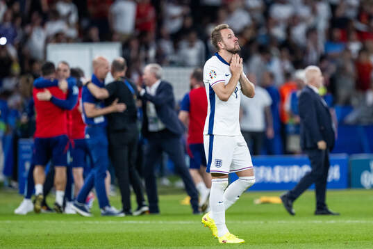 Harry Kane of England looks dejected