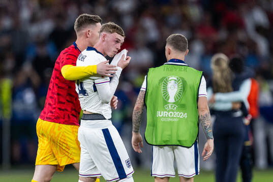 Cole Palmer of England looks dejected