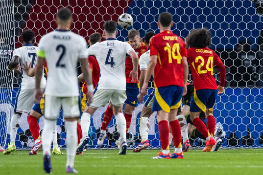 Daniel Olmo of Spain clears a ball