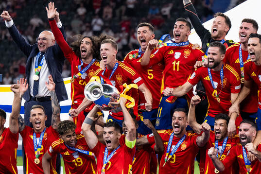 Alvaro Morata of Spain celebrates with the trophy in front