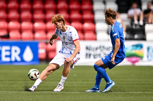 Håkon Røsten of Norway in action against Luca Di Maggio
