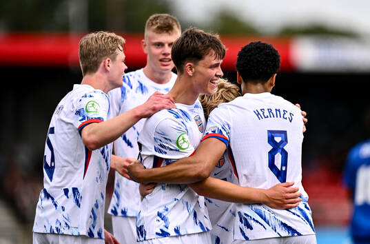 Daniel Braut of Norway celebrates with teammates