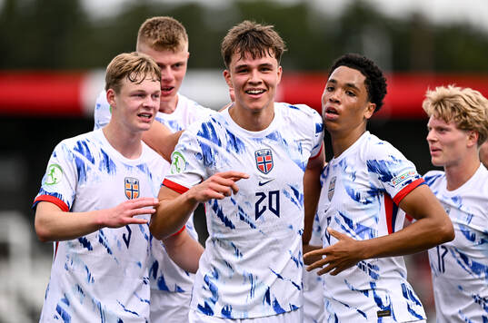 Daniel Braut of Norway celebrates with teammates