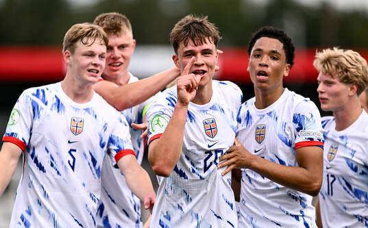 Daniel Braut of Norway celebrates with teammates