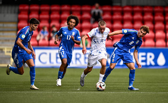 Mats Pedersen of Norway in action against Italy players,