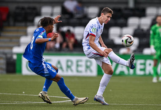 Eivind Helland of Norway in action against Kevin Zeroli of