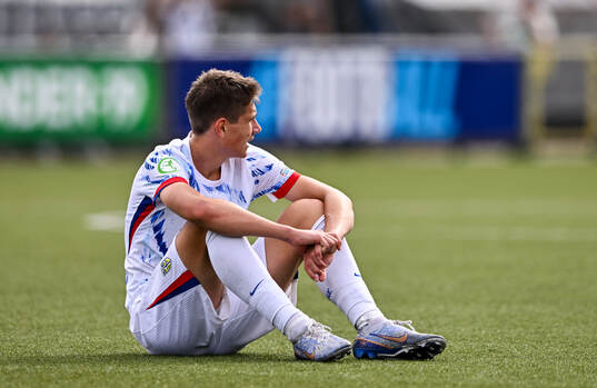 Eivind Helland of Norway dejected at the final whistle of