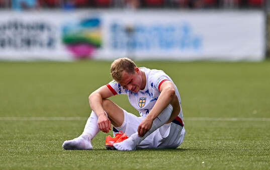 Aleksander Andresen of Norway dejected at the final whistle
