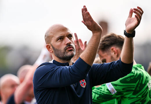 Norway head coach Luis Pimenta applauds toward the