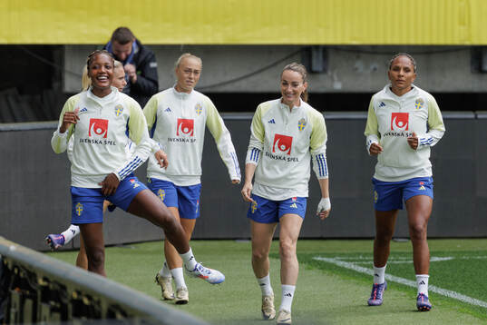 Evelyn Ijeh and Kosovare Asllani of the Swedish women's