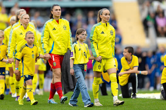 Goalkeeper Zecira Musovic and Kosovare Asllani  of Sweden