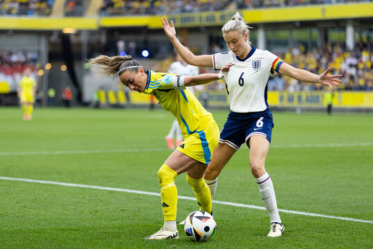Kosovare Asllani of Sweden and Leah Williamson of England