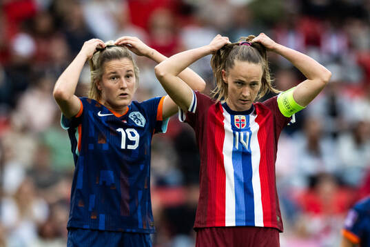 Wieke Kaptein of Netherlands and Caroline Graham Hansen of