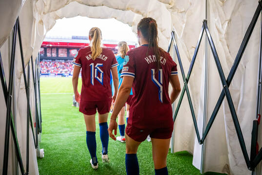 Mathilde Harviken and Tuva Hansen of Norway at half-time