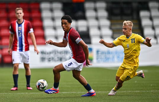 Travis Hernes of Norway in action against Danylo Krevsun of