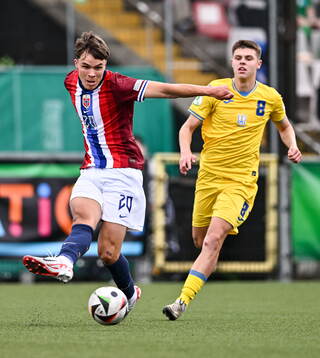 Daniel Braut of Norway in action against Daniil Vashchenko