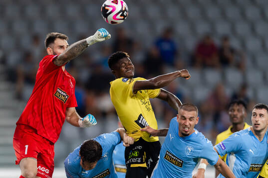 Goalkeeper Ivica Ivusic of Pafos and Jalal Abdullai  of