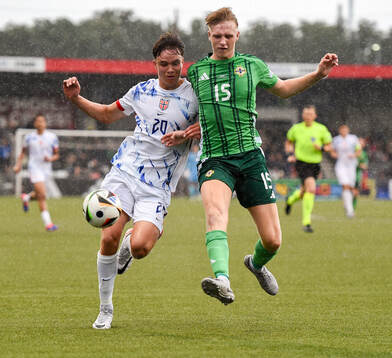 Daniel Braut of Norway in action against Tom Atcheson of