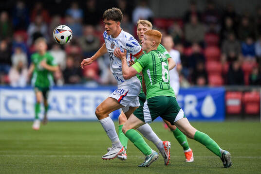Daniel Braut of Norway is tackled by Gallagher Lennon of