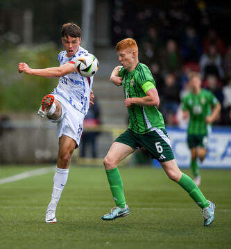 Daniel Braut of Norway is tackled by Gallagher Lennon of