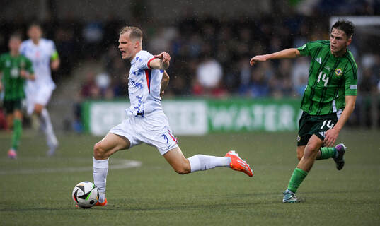 Alexander Andresen of Norway is tackled by Jack Doherty of