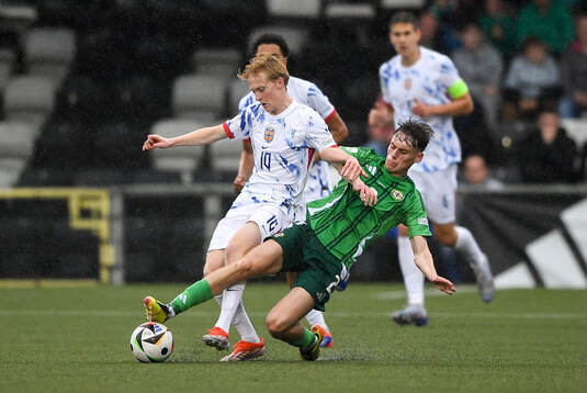 Sondre Granaas of Norway is tackled by Conor Barr of