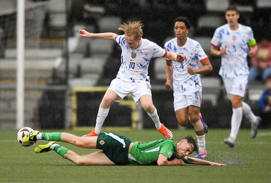 Sondre Granaas of Norway is tackled by Conor Barr of