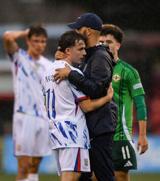 Edvin Austbo of Norway hugs head coach Luis Pimenta