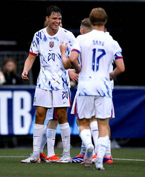 Daniel Braut of Norway celebrates with team-mates