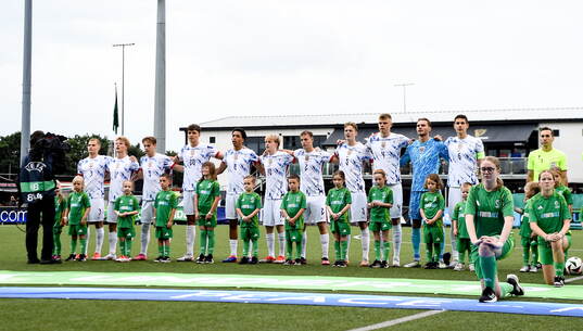 The Norway team stands for the playing of the national