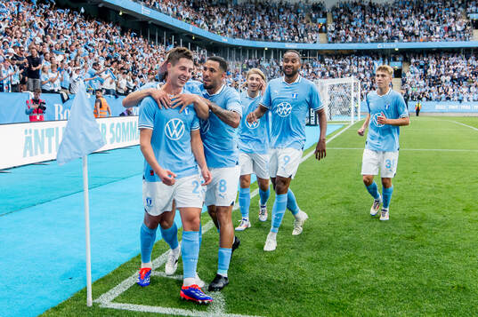 Players of Malmö FF celebrate the 3-0 goal by Lasse Berg