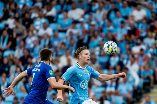 Nils Zetterström of Malmö FF and Arni Frederiksberg of