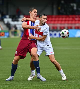 Eivind Helland of Norway in action against Berkay Yilmaz of
